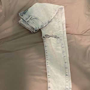 Light wash jeans, very comfortable with two holes in the knees.